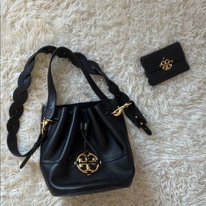Tory Burch Black and Gold Crossbody Bag with Floral Emblem